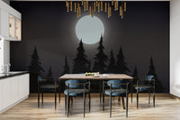 Mystical Moonlit Forest wallpaper with glowing moon over black pines behind a dining table and blue chairs