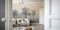 Leafless trees in fog wall mural for serene spaces

