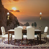 Sunrise Cliffs scenic ocean view wall mural; dazzling sun over massive crags.