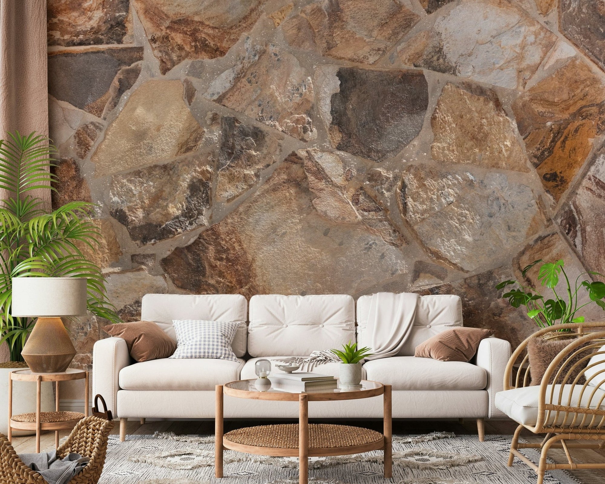 Natural Stone Fusion wallpaper mural in earthy flagstone behind a cream sofa and round wood table