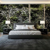 Weathered stone and foliage mural in lounge, muted grey and olive tones