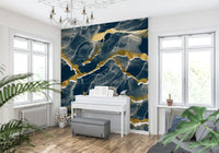 A modern abstract Marble Wallpaper featuring a deep navy blue background intersected by elegant golden veins.