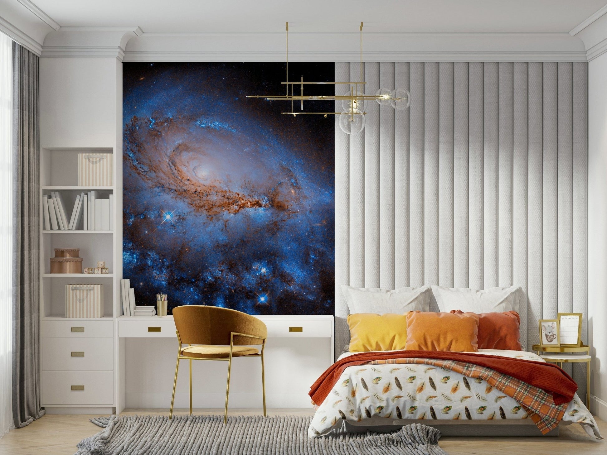 Nebula Dreams wall mural of a spiral galaxy behind a bed with mustard cushions and a gold desk chair in a bedroom