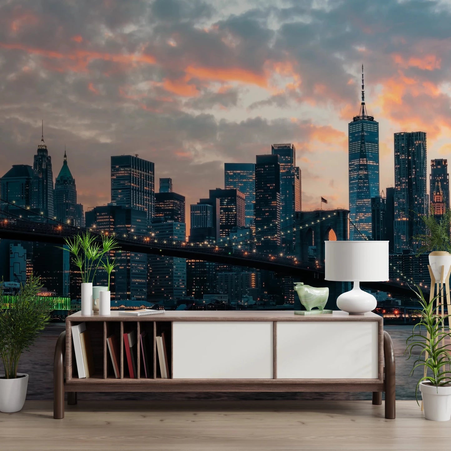 New York In The Evening wallpaper mural of the lit skyline above a wood sideboard with a white lamp