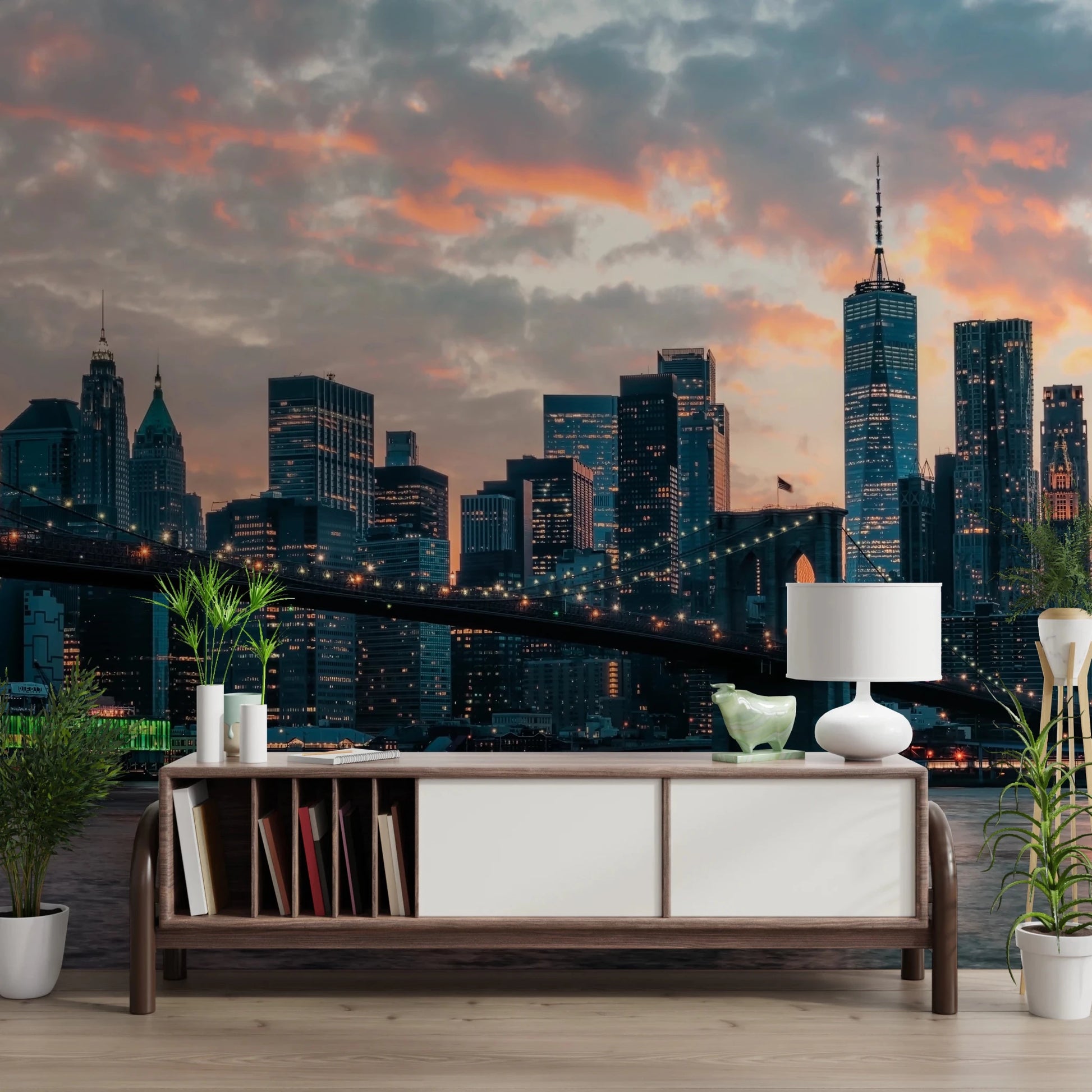 New York In The Evening wallpaper mural of the lit skyline above a wood sideboard with a white lamp