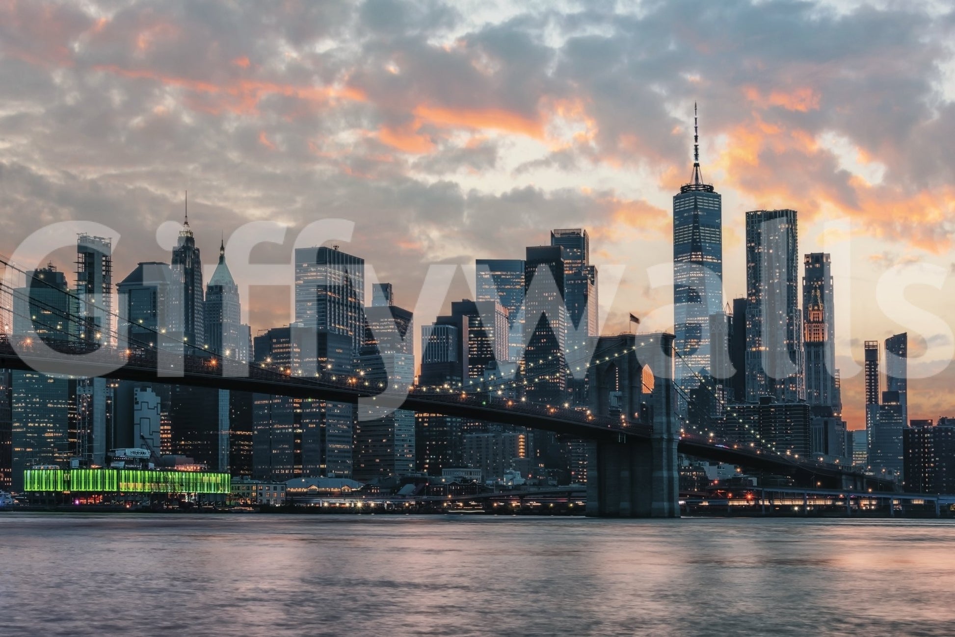 New York In The Evening wallpaper mural shown as a full-wall Manhattan skyline and Brooklyn Bridge at sunset