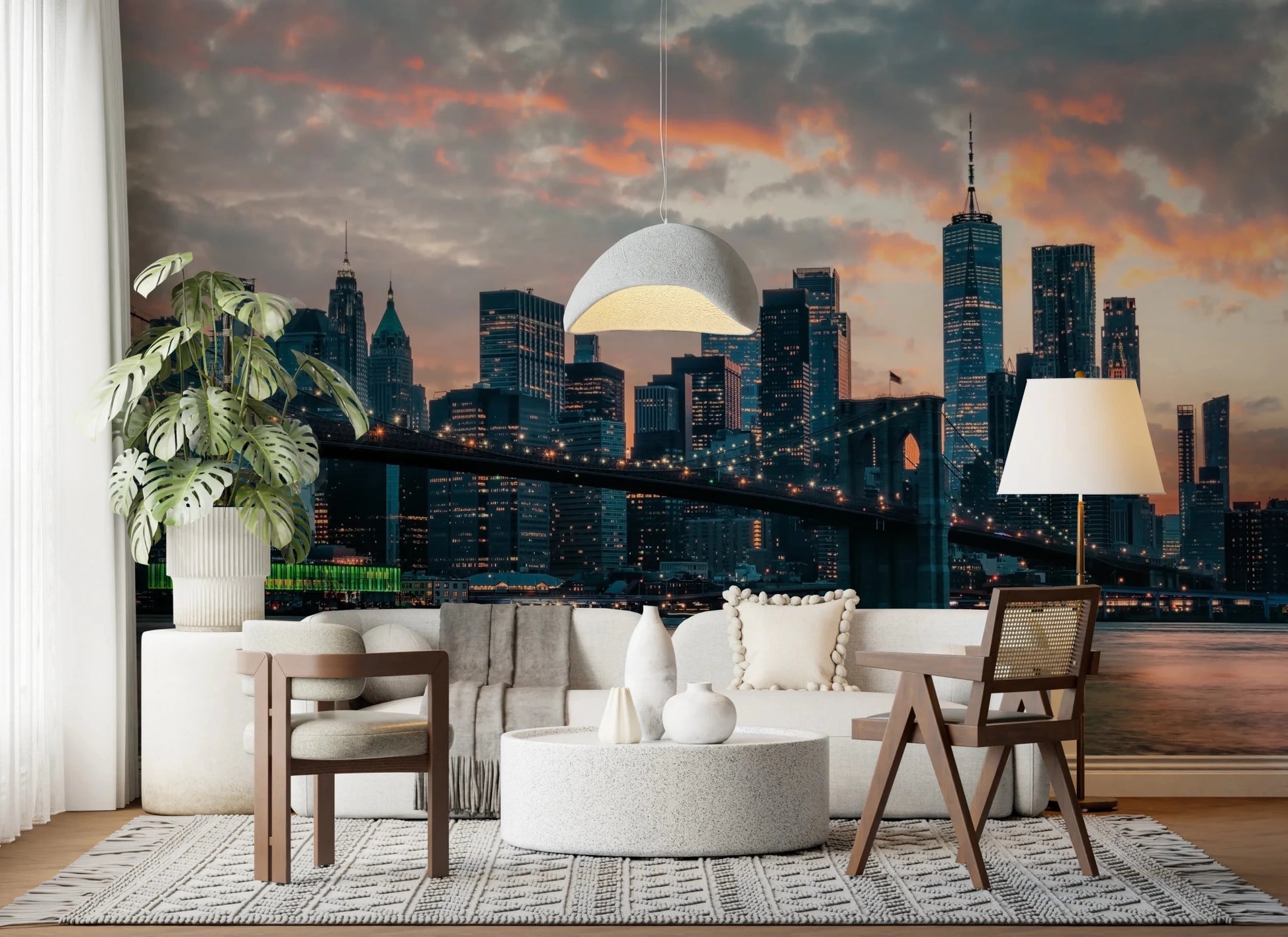 New York In The Evening wallpaper mural of the dusk skyline in a living room with a white sofa and dome pendant
