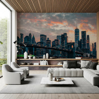 New York In The Evening wallpaper mural of the sunset skyline in a living room with a grey sectional and wood ceiling