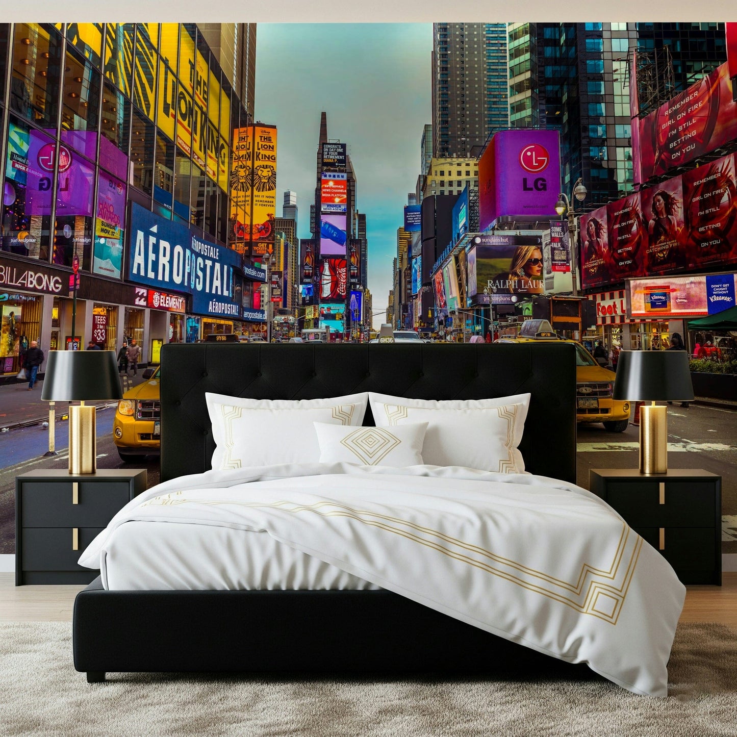 New York's Urban Pulse mural of Times Square behind a black tufted bed with white and gold bedding