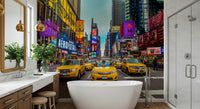 New York's Urban Pulse mural of yellow cabs in Times Square in a bathroom with freestanding tub