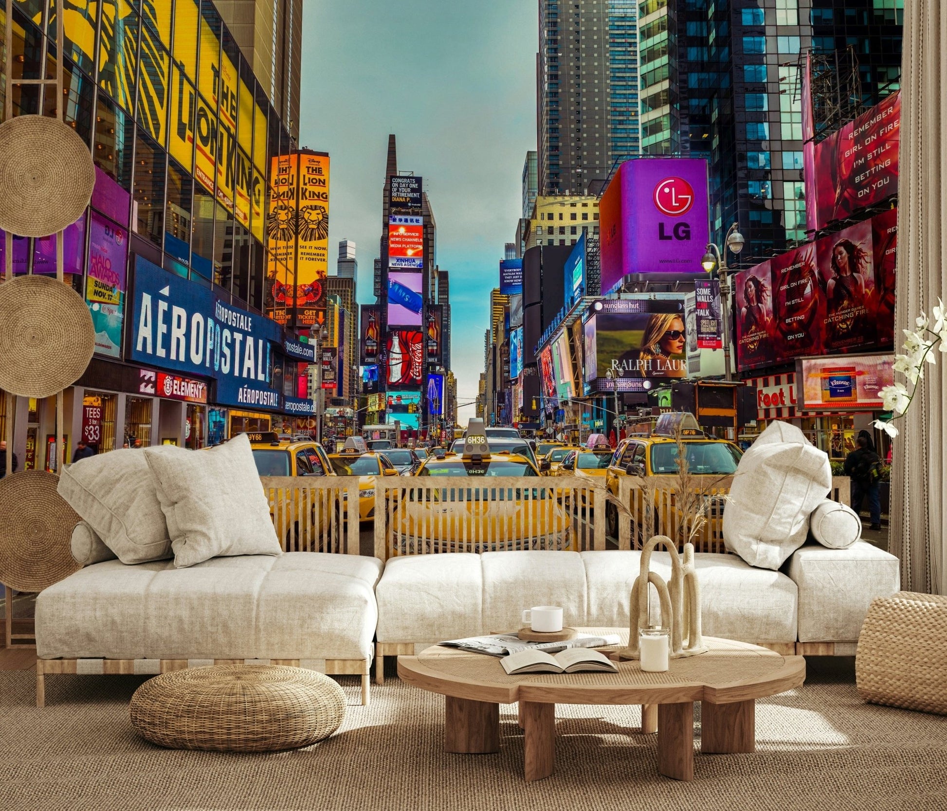 New York's Urban Pulse mural of Times Square behind a cream boucle sofa with rattan accents
