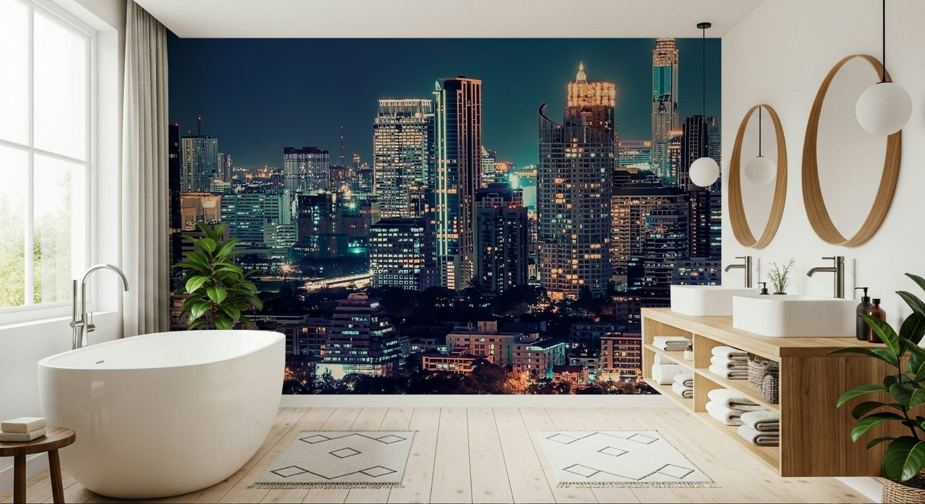 Night cityscape wallpaper behind sofa, deep colour tones and warm light details