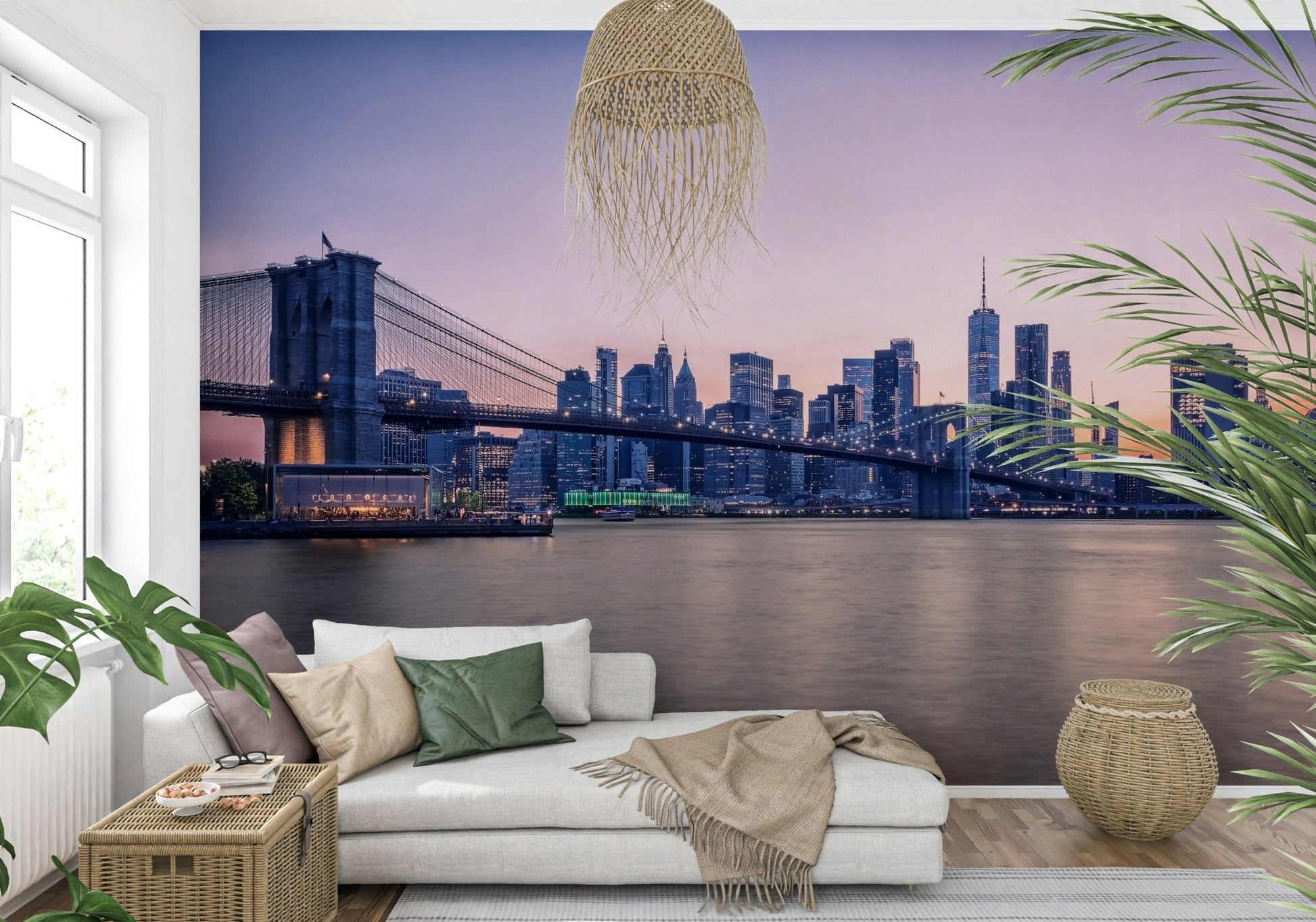 NYC Bridge at Dusk wallpaper mural of the dusk skyline behind a white chaise daybed in a plant-filled living room