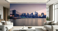 NYC Bridge at Dusk wallpaper mural of the bridge over the river between two white sofas in a bright living room