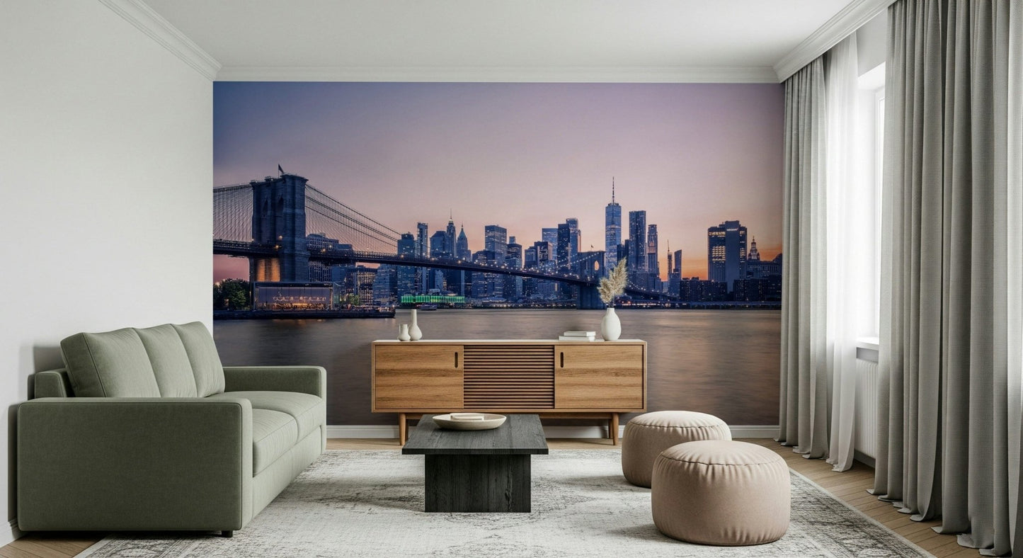 NYC Bridge at Dusk wallpaper mural of the bridge at dusk behind a green sofa and wood sideboard in a living room