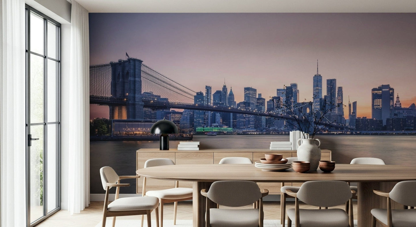 NYC Bridge at Dusk wallpaper mural of the Brooklyn Bridge at dusk above a wood dining table and chairs in a dining room