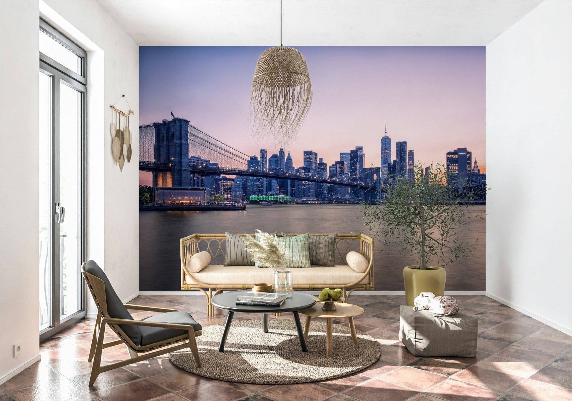 NYC Bridge at Dusk wallpaper mural of the bridge at twilight behind a cane sofa and black coffee table in a living room