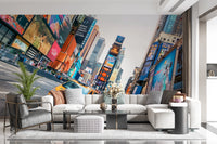 NYC Buzz wallpaper mural of Times Square screens above a white sectional and grey armchair in a living room