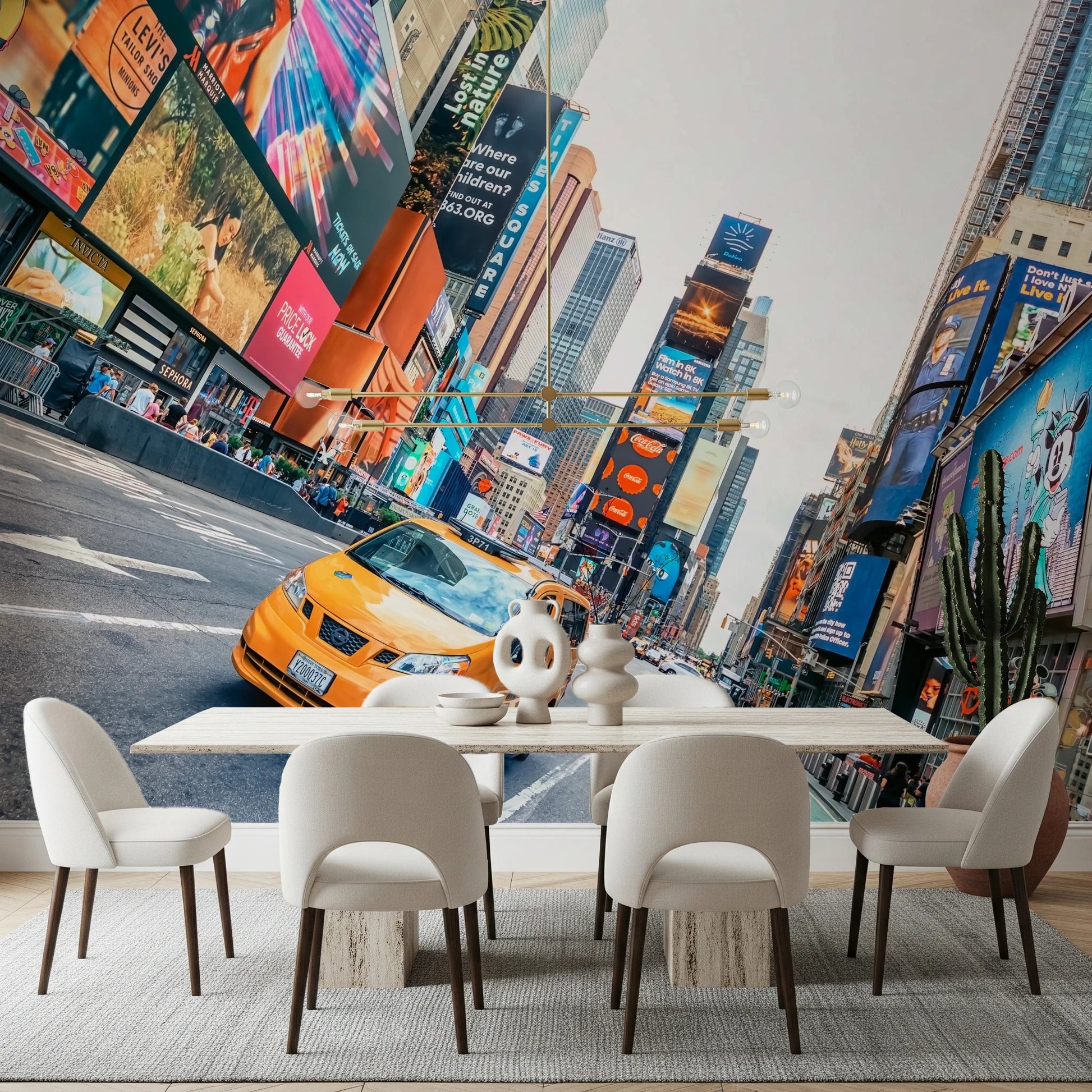 NYC Buzz wallpaper mural of a yellow cab in Times Square behind a marble dining table and cream chairs in a dining room