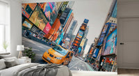 NYC Buzz wallpaper mural with a yellow taxi and bright billboards behind a grey bed and white nightstand in a bedroom