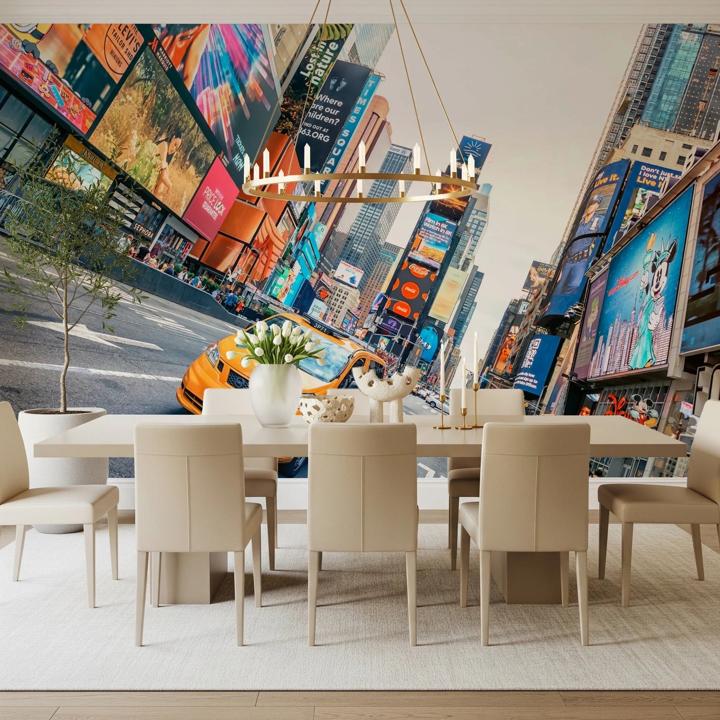 NYC Buzz wallpaper mural of Times Square behind a long cream dining table with leather chairs and a brass chandelier