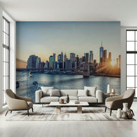 NYC Skyline at Dawn wallpaper mural of the dawn skyline behind a white sofa flanked by armchairs in a living room