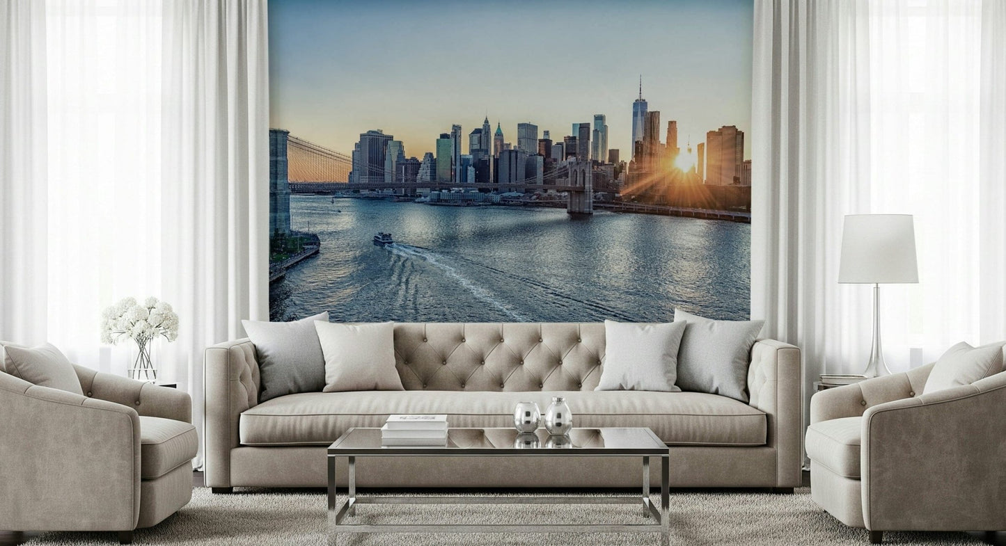 NYC Skyline at Dawn wallpaper mural of the dawn-lit city behind a beige tufted sofa and armchairs in a living room