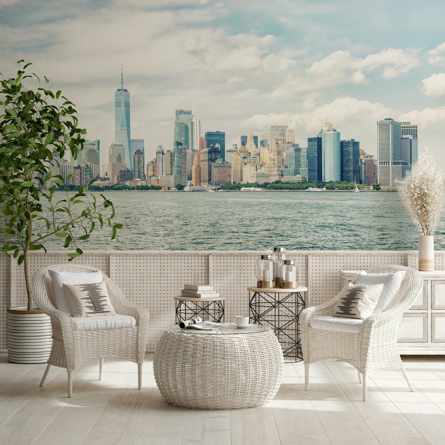 NYC Skyline View wallpaper mural of the harbor skyline behind white rattan armchairs and a woven table in a sunroom