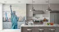 NYC's Lady Liberty wallpaper mural showing the statue and harbour beside a marble kitchen island with bar stools