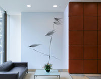 A high-angle view of the wall mural in a large space.

