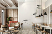 The wallpaper is used as a feature wall in a bedroom.

