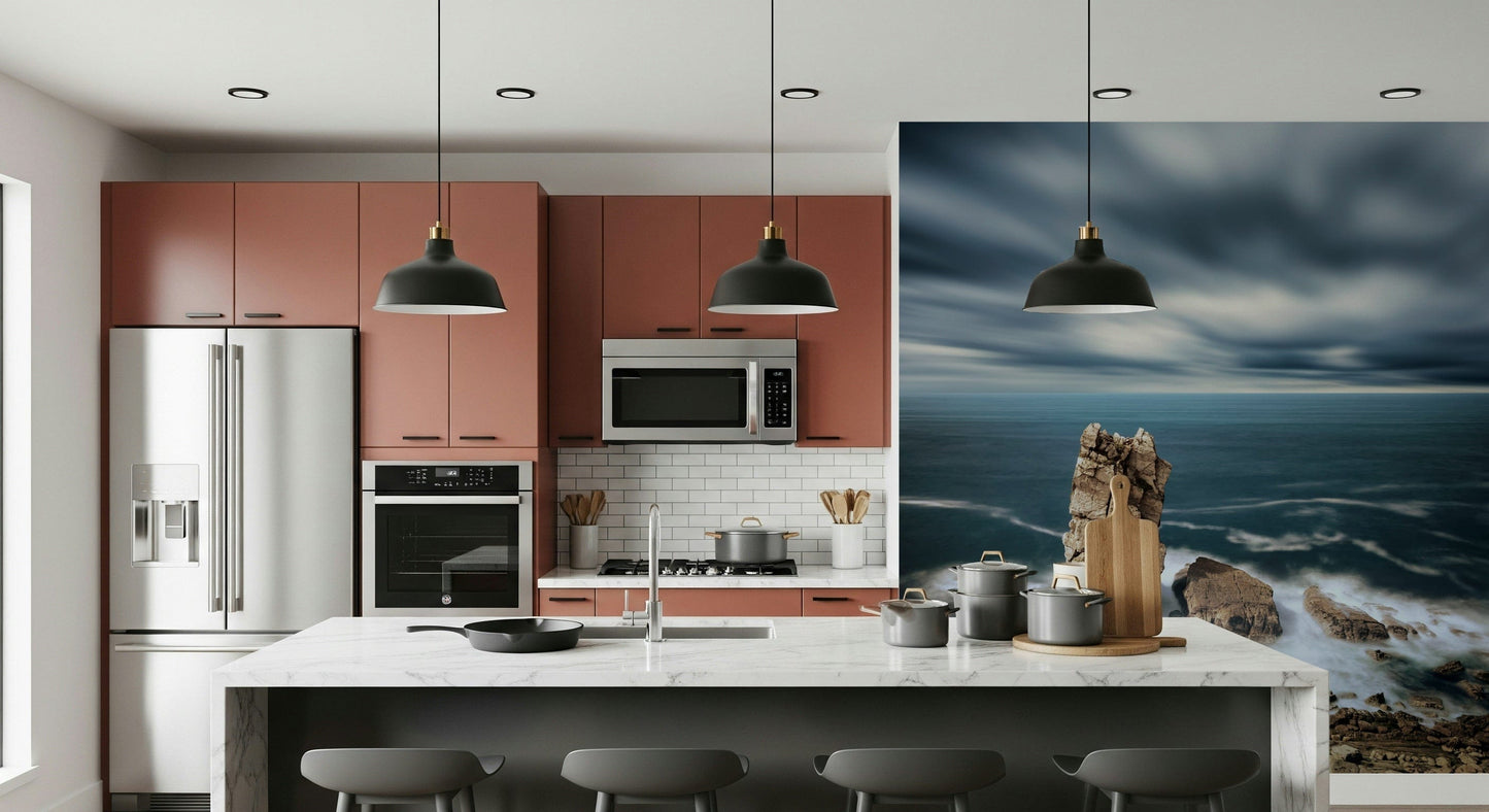 Ocean edge mural behind gray sectional, airy coastal living room feature wall