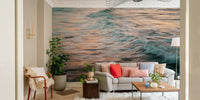 A contemporary living room with a large ocean wave wall mural.

