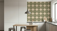 Modern geometric wallpaper with oversized olive circles arranged in a clean repeating grid