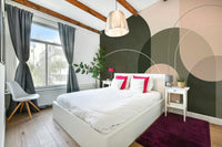 Earth-toned mural wallpaper in warm olive hues

