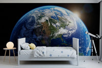 Teen room with space wall mural and luminous Earth curve scene