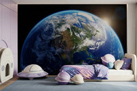 Girls room with Earth sunrise wall mural and cosmic sky view