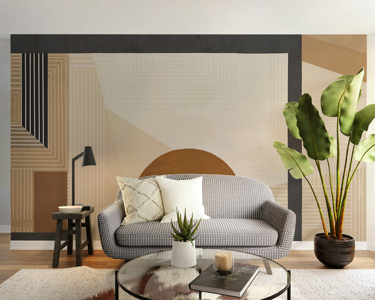 Geometric Modern Art wallpaper mural in tan tones behind a grey houndstooth sofa and tall green plant