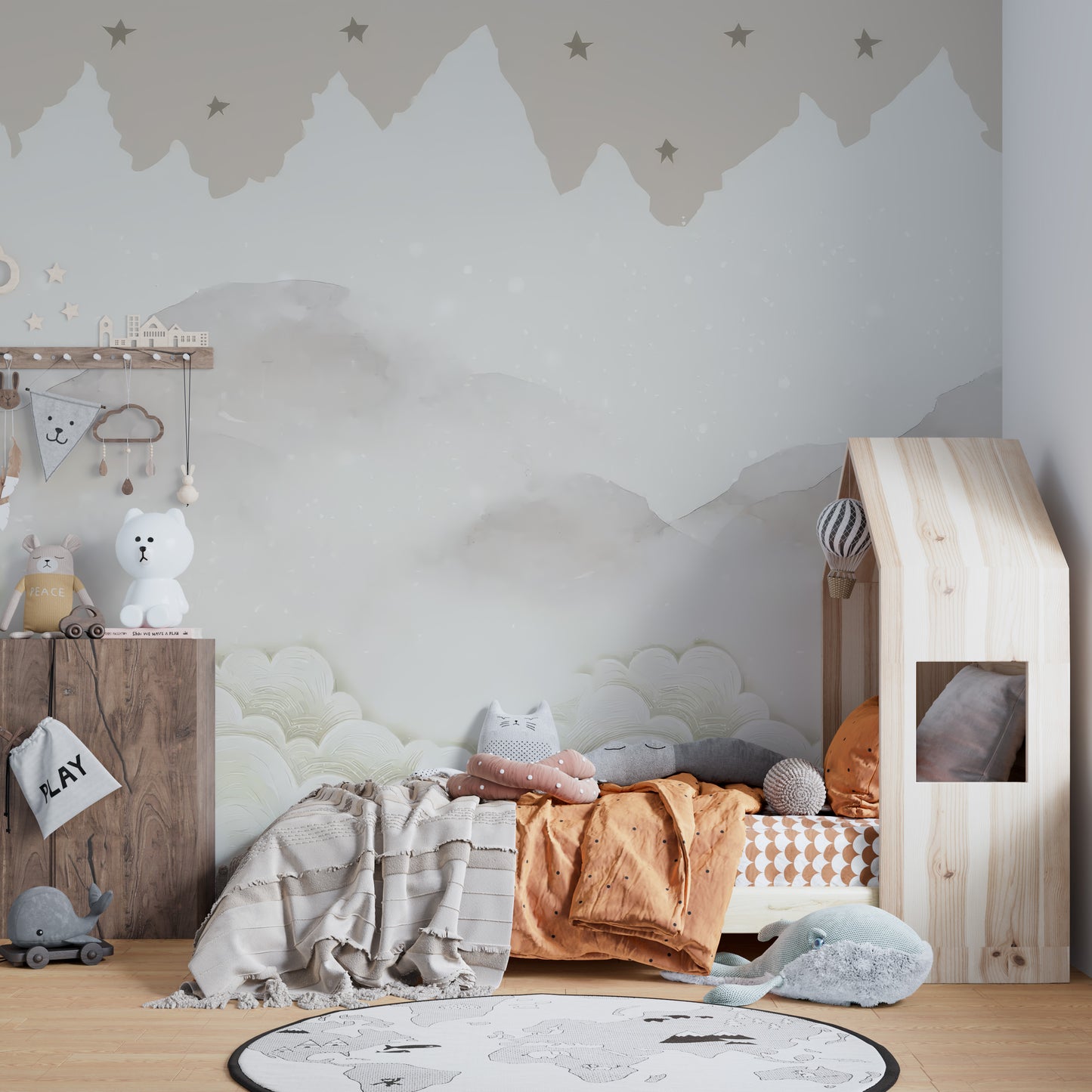 Serene Mountain Peaks wallpaper mural of misty peaks and stars in a kids room with wood house-frame bed and world-map rug