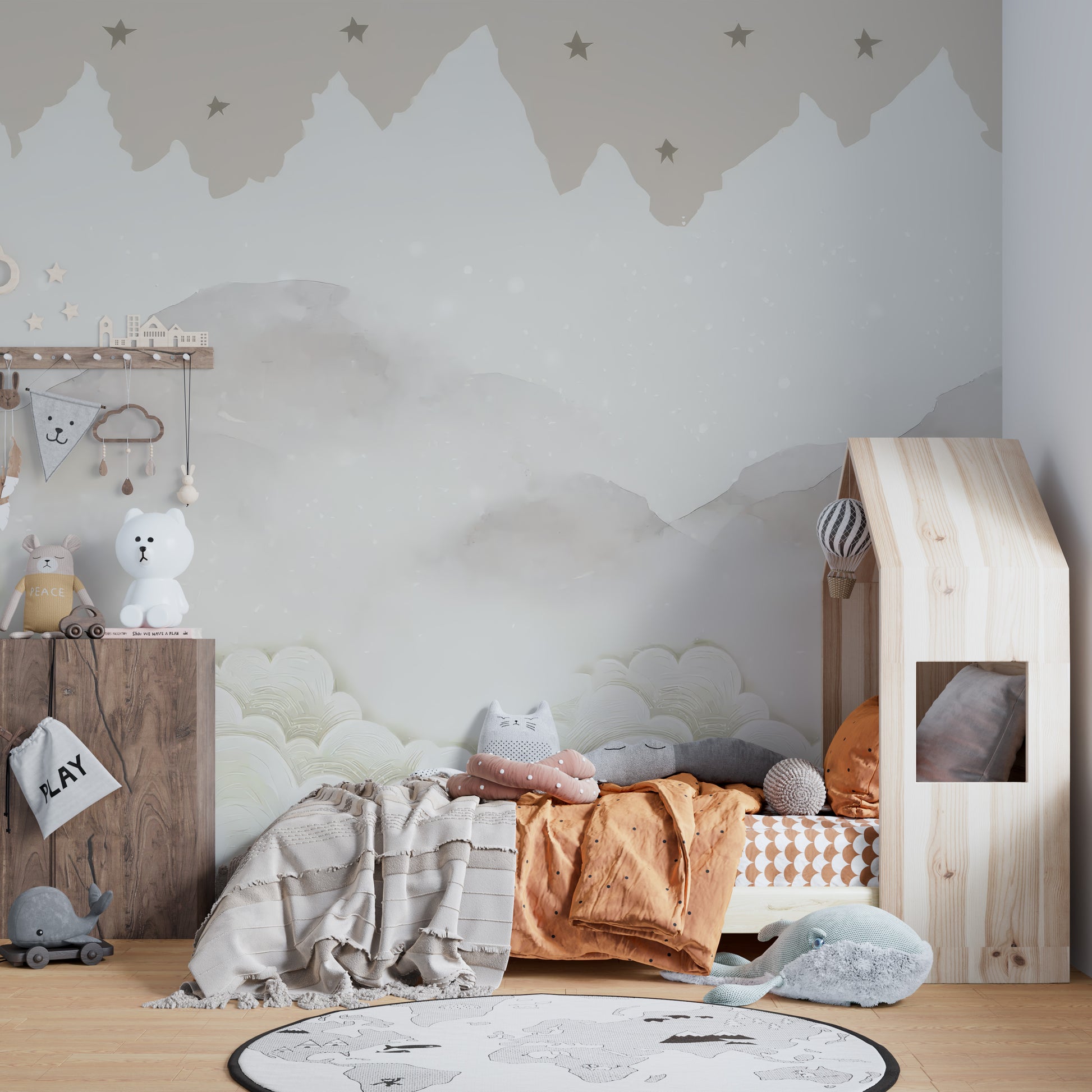 Serene Mountain Peaks wallpaper mural of misty peaks and stars in a kids room with wood house-frame bed and world-map rug