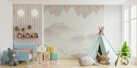 Serene Mountain Peaks wallpaper mural in muted beige in a kids room with blue toddler bed, teddy bear and mint teepee
