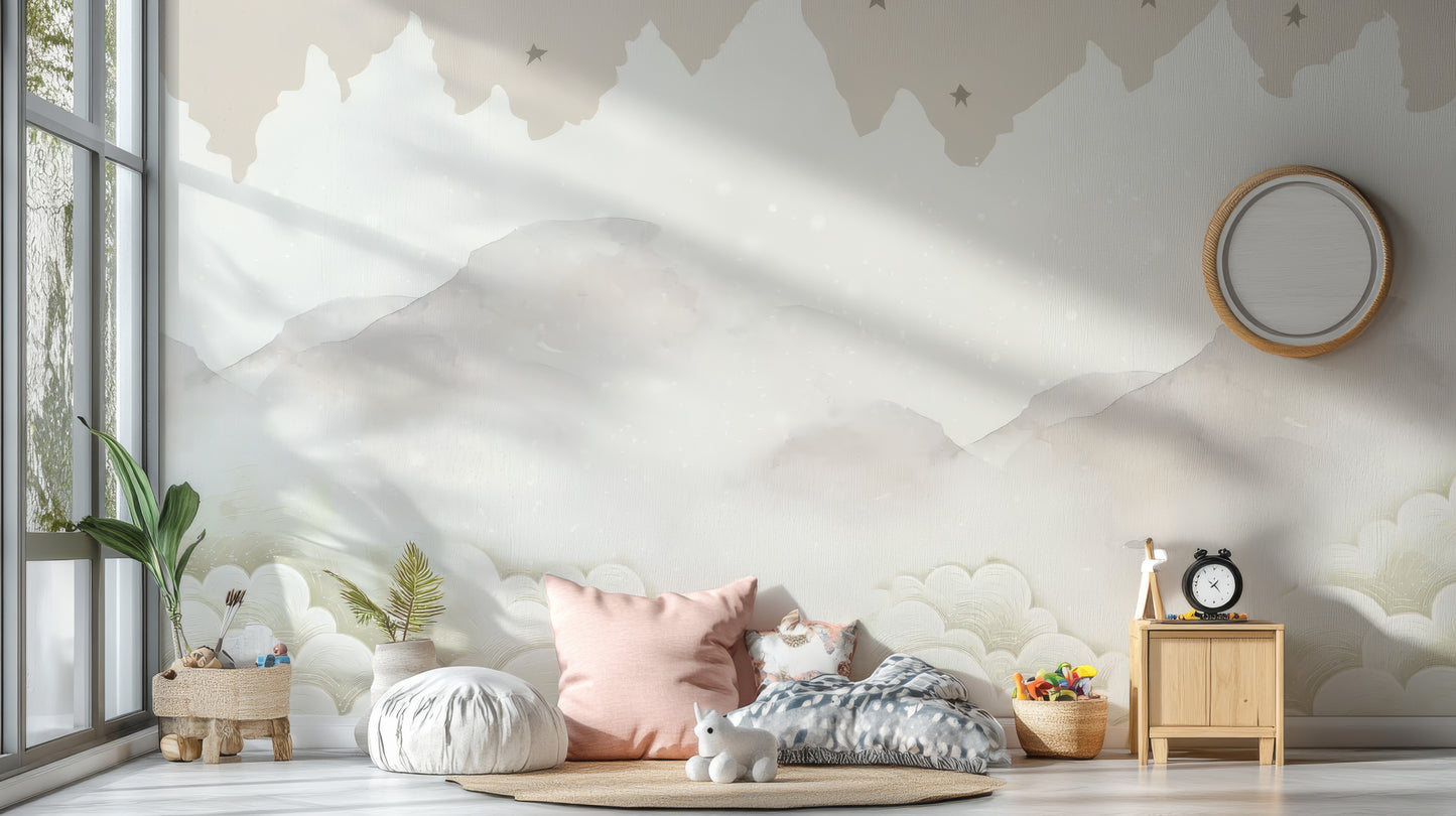 Serene Mountain Peaks wallpaper mural of soft clouds and stars in a nursery with floor cushions, pink pillow and toy unicorn
