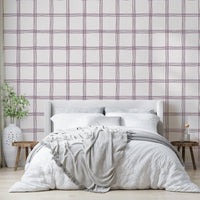 Mauve and beige wallpaper featuring an imperfect square grid.

