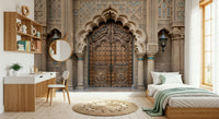 Ornate Entryway wallpaper mural of a stone-arched door in a bedroom with a wood bed, sage throw and white desk