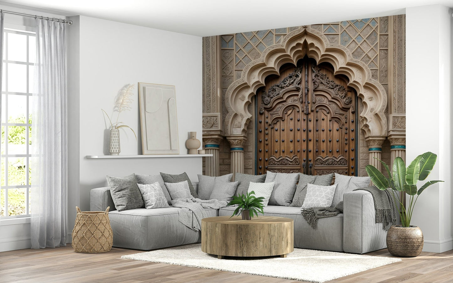Ornate Entryway wallpaper mural with a carved arched doorway behind a grey sectional sofa and round wood table