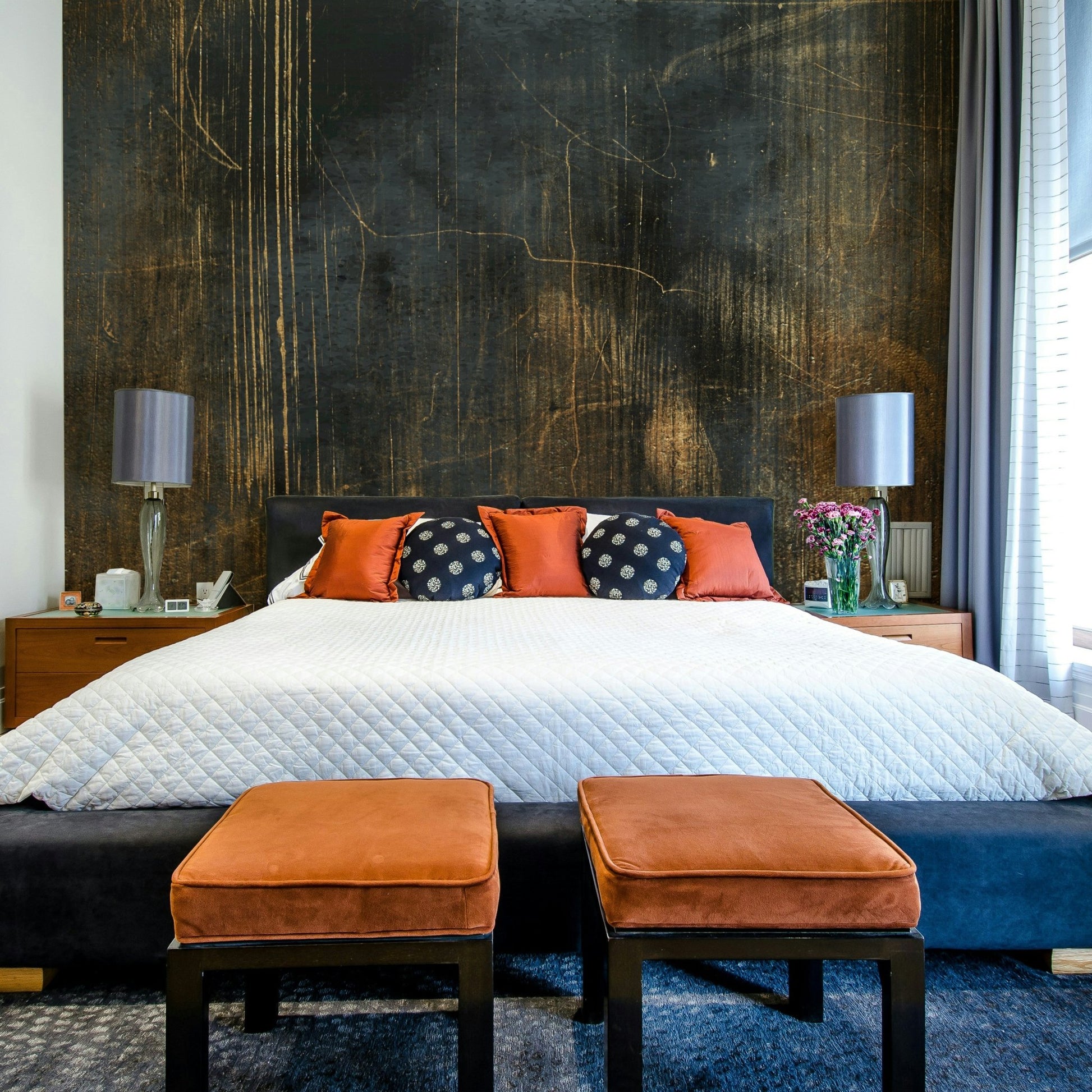 Subtle floral or organic motifs in a wall mural.

