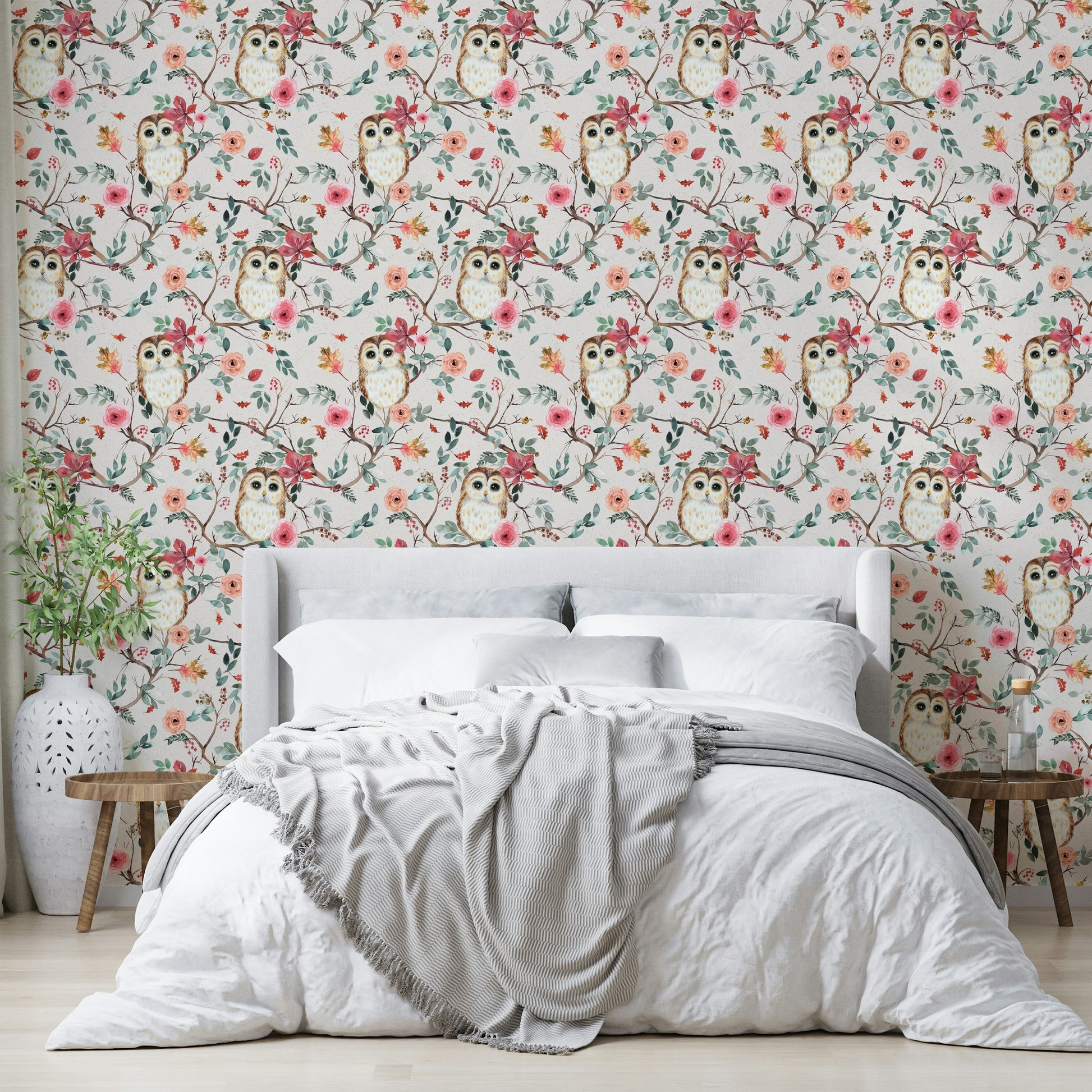 Owl nestled in tree branches on green and red wallpaper

