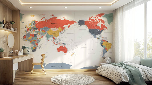 Pacific Centered World Map in Happy Colors wallpaper mural behind a wood kids desk and chair with floral bedding