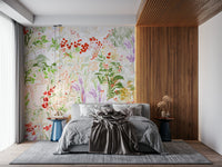 Hand-painted meadow wallpaper featuring flowing greenery and vibrant blossoms on a light background.