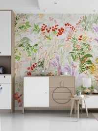 Floral meadow wallpaper with artistic watercolor-style leaves and blossoms in fresh spring tones.